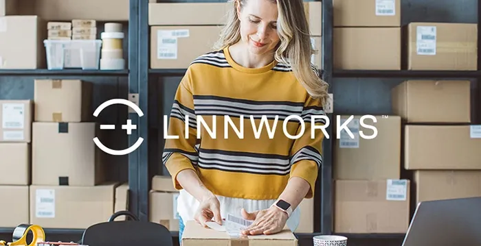 woman packing orders in an ecommerce warehouse