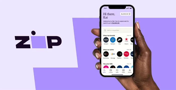 A hand holding a phone showing online store.