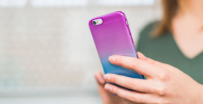 A woman holding a phone.