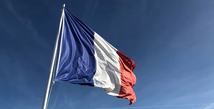 French flag flying in the air.