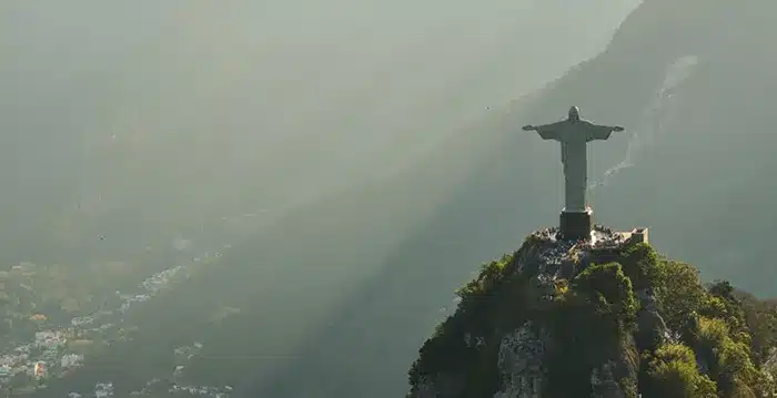 A statue on a hill.