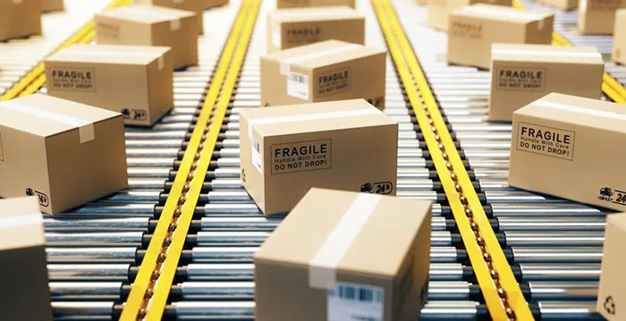 An image of packages on a conveyer belt.