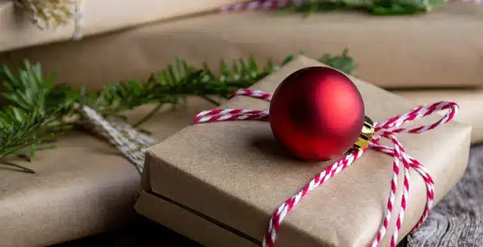 A gift decorated with a red ball.