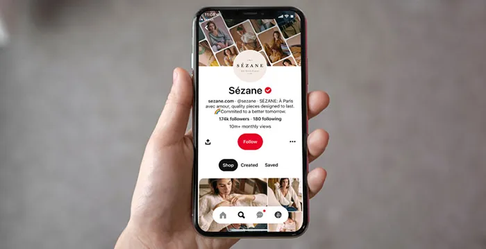 A hand holding a phone.