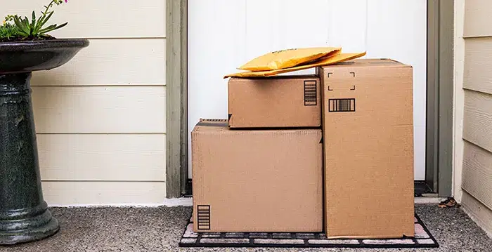 A couple of boxes in front of a door.