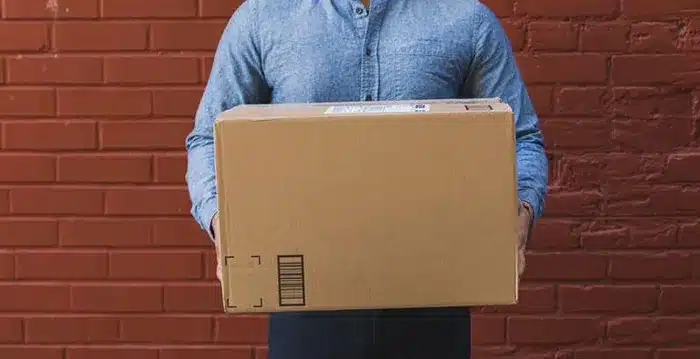 A person holding a box.
