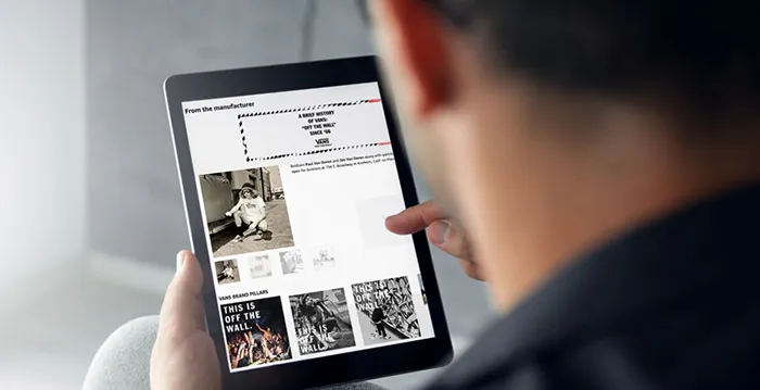 Person holding tablet.