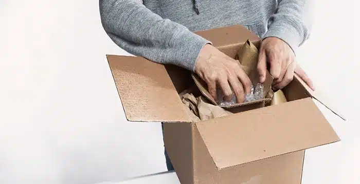 A person opening a box.