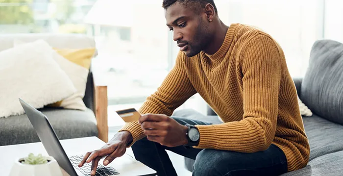 Man managing an ecommerce business on a computer.