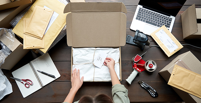 A person packing a gift.