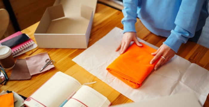 A person opening a box.