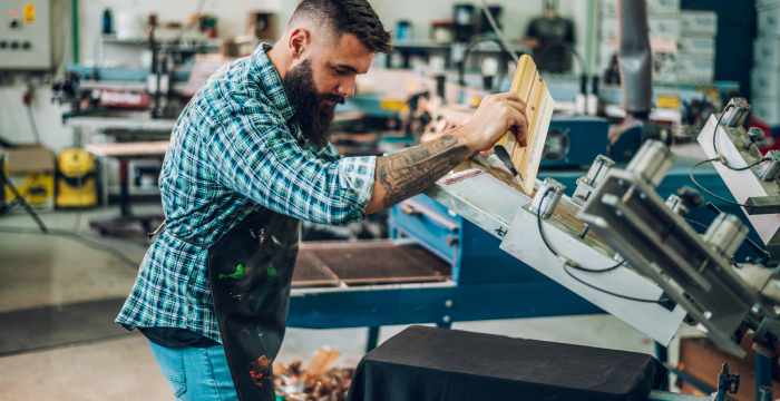 An ecommerce business owner creates a customized t-shirt for Amazon Custom