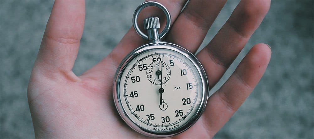 a stopwatch in someones palm