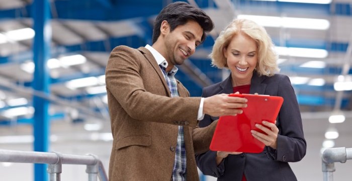 Colleagues following inventory audit procedures to check warehouse stock