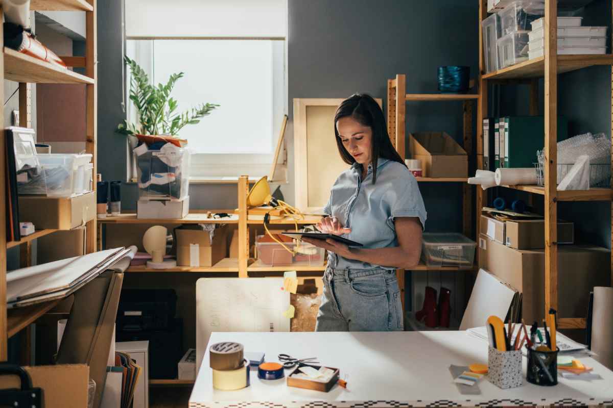 Woman checking minimum stock levels in home office