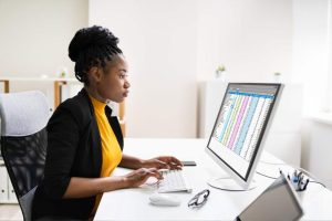 Woman forecasting demand based on inventory levels
