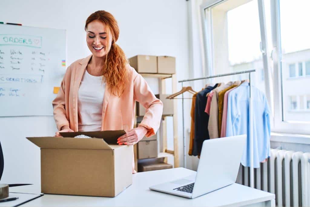 Woman packing orders in home office