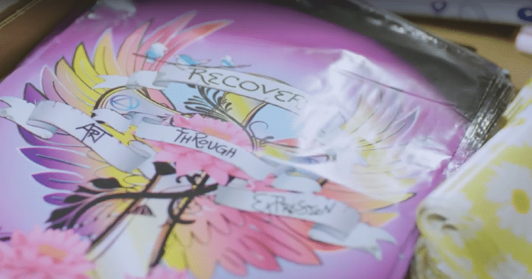 A poster of a winged animal that says Recover Through Art and Expression