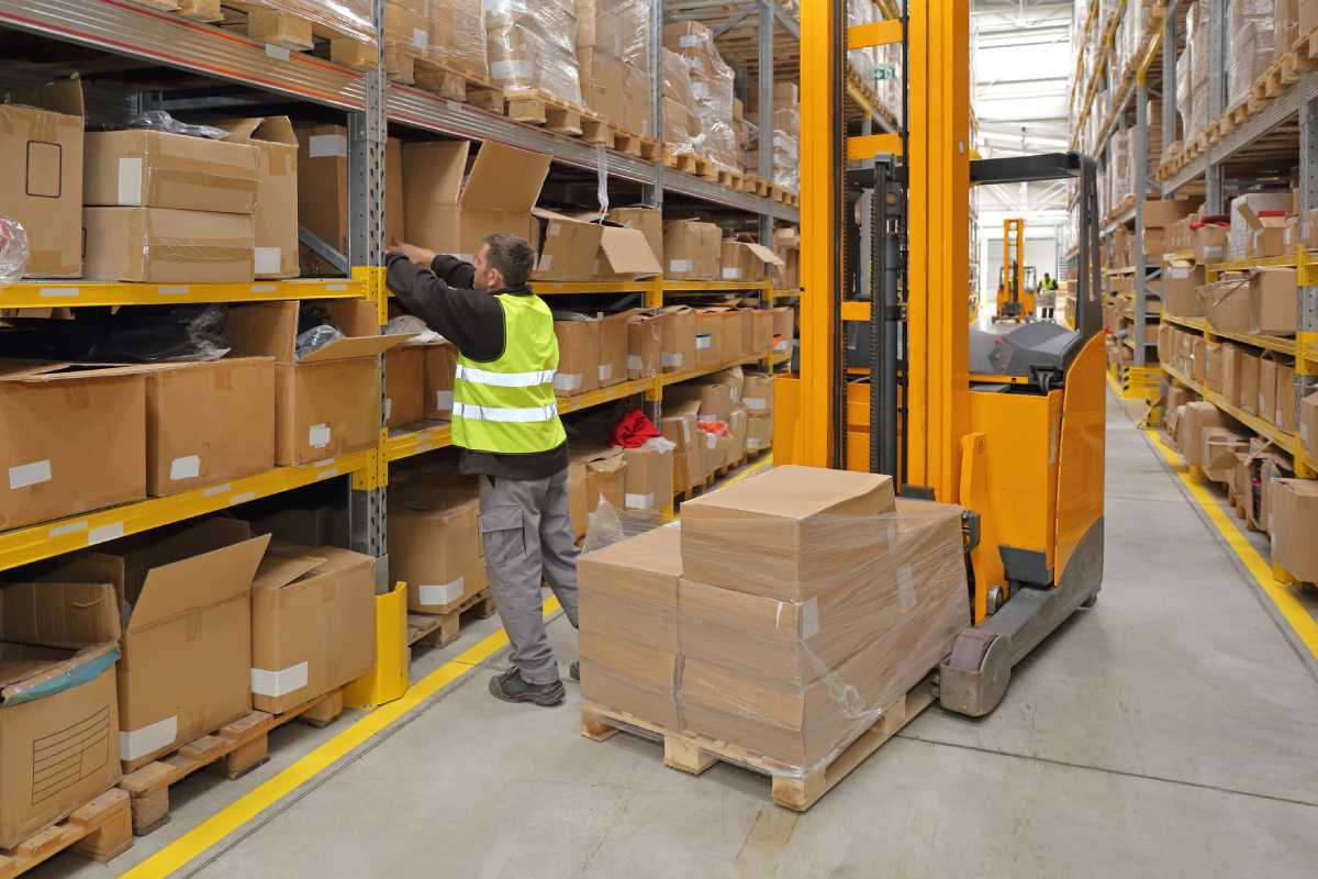 Warehouse worker replenishing inventory