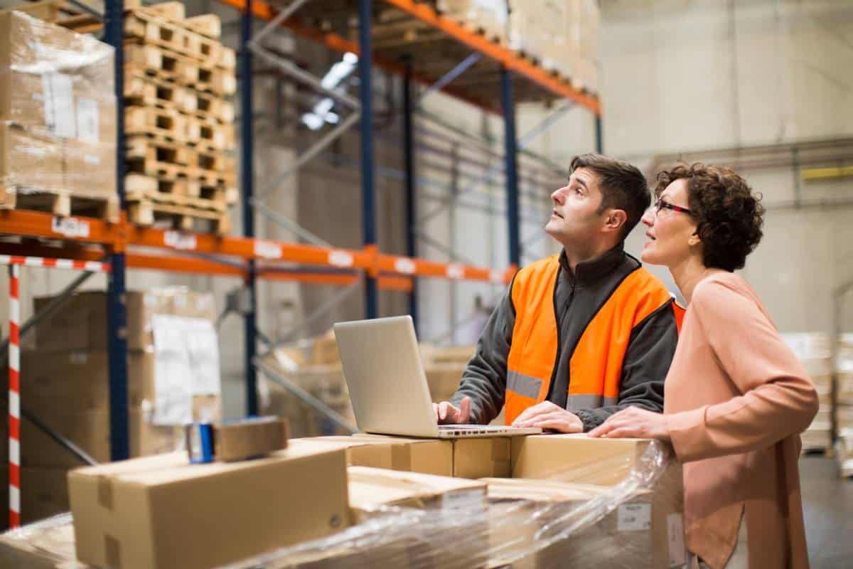 Warehouse staff conducting inventory supply chain checks