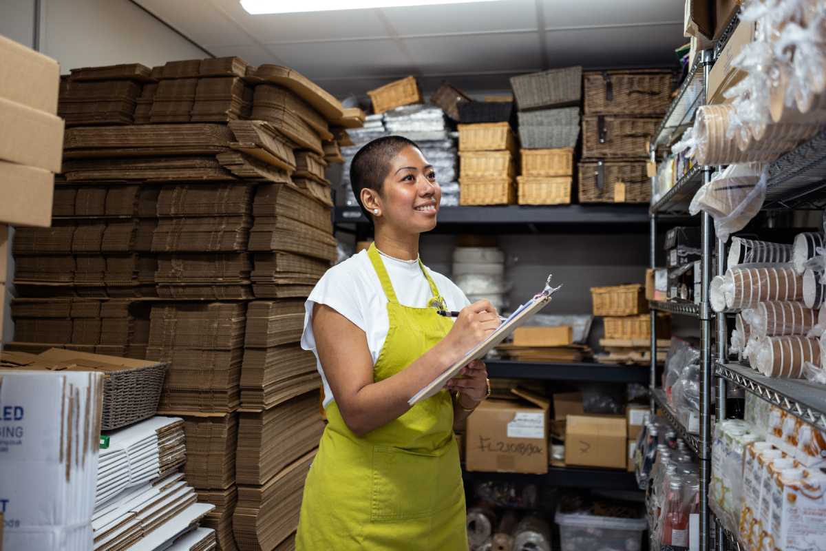 Business owner doing stock checks for inventory replenishment